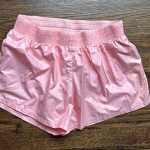 Nike Shiny Pink Running/Gym Shorts with Gold Logo Medium
